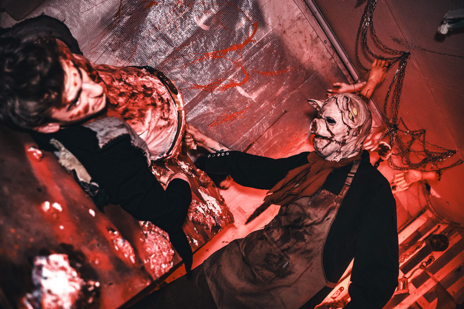Performer in a blood-red corridor